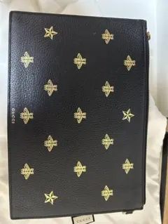GUCCI ゴールド星プリント クラッチバッグ