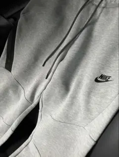 ナイキテックフリースグレー サイズMボトムス