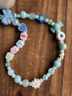 水色のCUTE文字ビーズ携帯ストラップ
