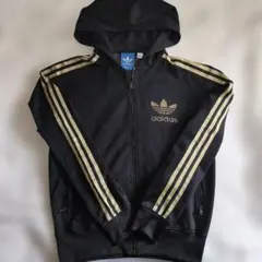 adidas のゴールドのライン　黒ジャージ　旧ロゴ フードつきジップアップのサムネイル