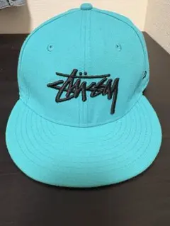 Stussy ターコイズ スナップバックキャップ
