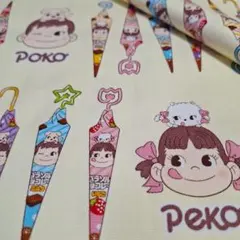 ★【ペコちゃん】パラソルチョコ<オックス> 生地 布 はぎれ[黄系]