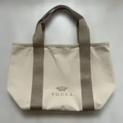 新品】TOCCA キャンバストートバッグ ベージュ× ゴールドハート柄