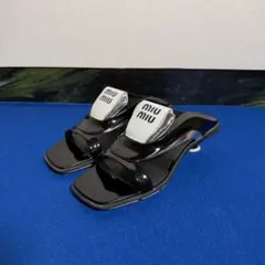 Miu Miu ミュウミュウ ミュール サンダル ロゴ ヒール 靴 黒 白レザーのサムネイル