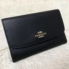 未使用保管 COACH 三つ折り財布 ブラック レザー ゴールドロゴのサムネイル