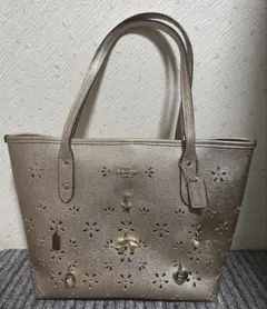 【訳アリ】COACH コーチ　バッグ ゴールド 花柄 パンチング ホリデー