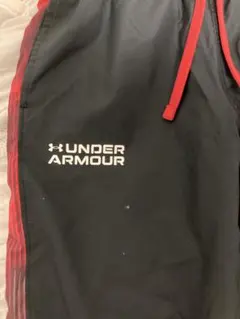 UNDER ARMOUR ジャージパンツ 黒/赤
