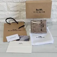 新品・未使用COACH コーチ 二つ折り財布 シグネチャー ブラウン C3309