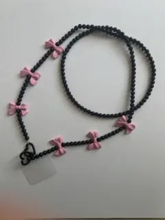 スマホストラップ ブラック ピンク リボン付き