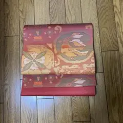 名古屋帯 花柄 オレンジ系 絹製　リメイク