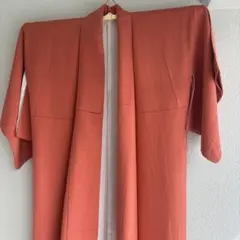 一つ紋　色無地　袷着物　ポリエステル素材　コーラルレッド系　クリーニング済み