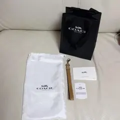 新品未使用　COACH （コーチ）ベージュレザー ストラップ キーホルダー