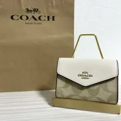 早い者勝ち！訳あり新品 COACH カードケース シグネチャー柄 バイカラー