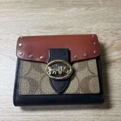 COACH 二つ折り財布 スタッズ付き