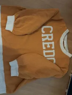 オレンジ 長袖ニットセーター