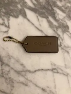 COACH ブラウン　レザー　チャーム　キーホルダー　タグ型