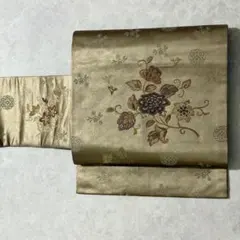 名古屋帯　中古　正絹　ベージュ　花唐草　ブロンズ　金　西陣織　mym171