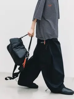 CLESSTE ITTI PADDED FLAP HOLIDAY BAG