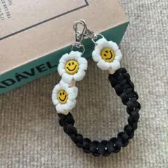 パラコード　ハンドスマホストラップ　☺︎ニコちゃん☺︎ お花　ハンドメイド