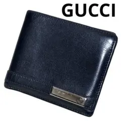 グッチ　折り財布　レザー　ブラック　ロゴプレート　フラップ　インターロッキング