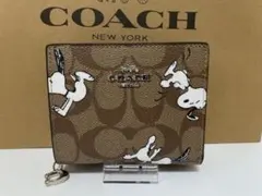 新品COACH コーチ スヌーピー コラボ 二つ折り財布 サーフィン - メルカリ