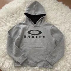専用ページOAKLEY グレー パーカー フード付き　140 美品
