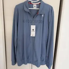 LE COQ SPORTIF ライトブルー ジャージ 上のみ メンズMサイズのサムネイル