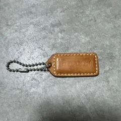 COACH ロゴチャーム タグ ㊿ ベージュ