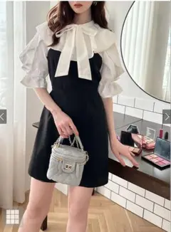 フリル付き黒と白のミニワンピース