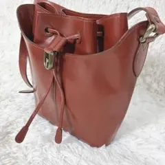 レノマ　レザー　巾着　ショルダーバッグ　真鍮ロゴ