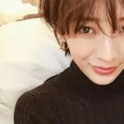 T.